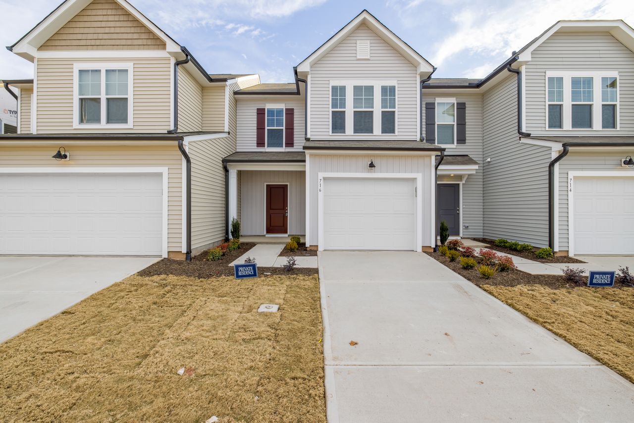 Ordinary suburban homes with garages and small front lawns