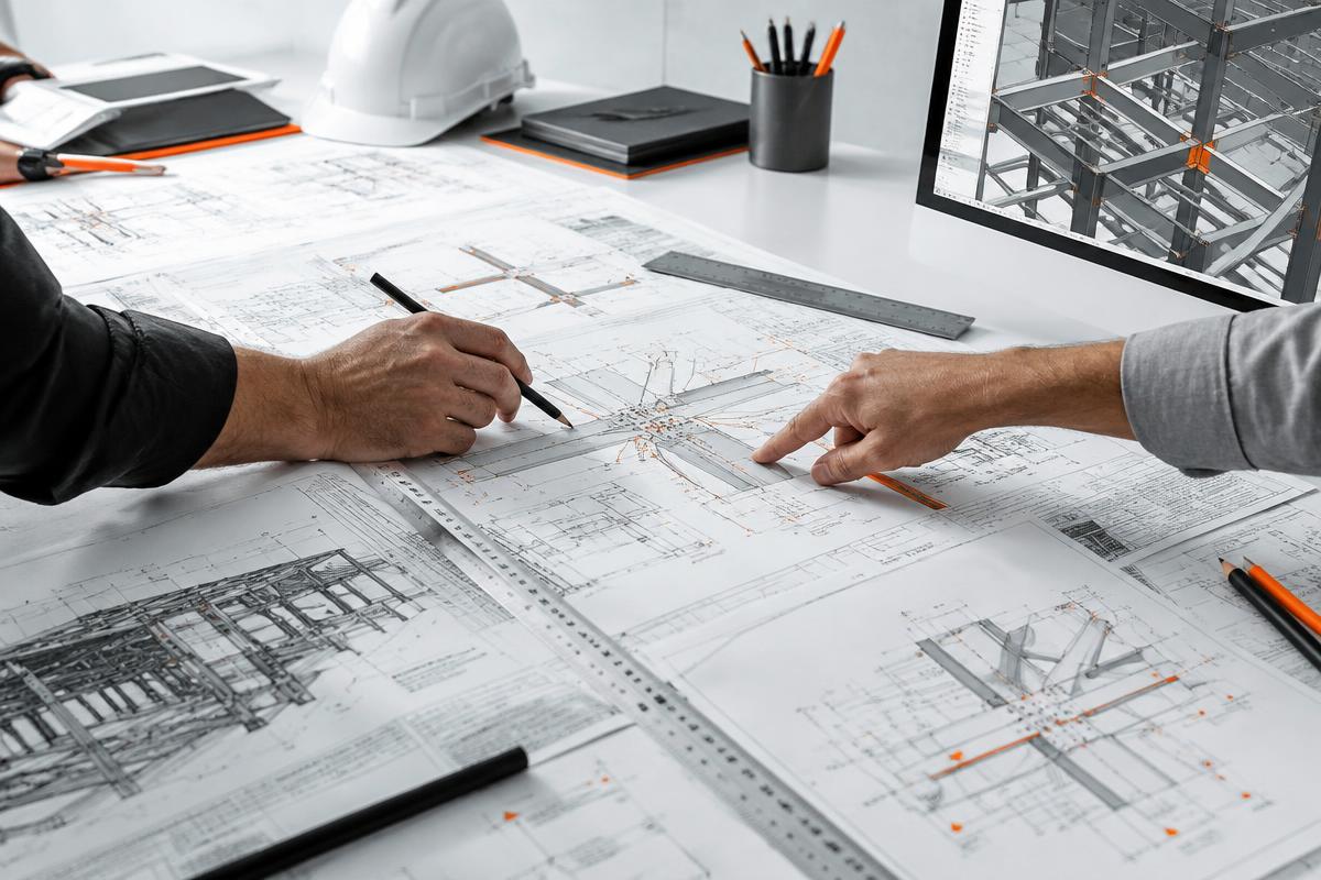 Project team reviewing coordinated engineering drawings